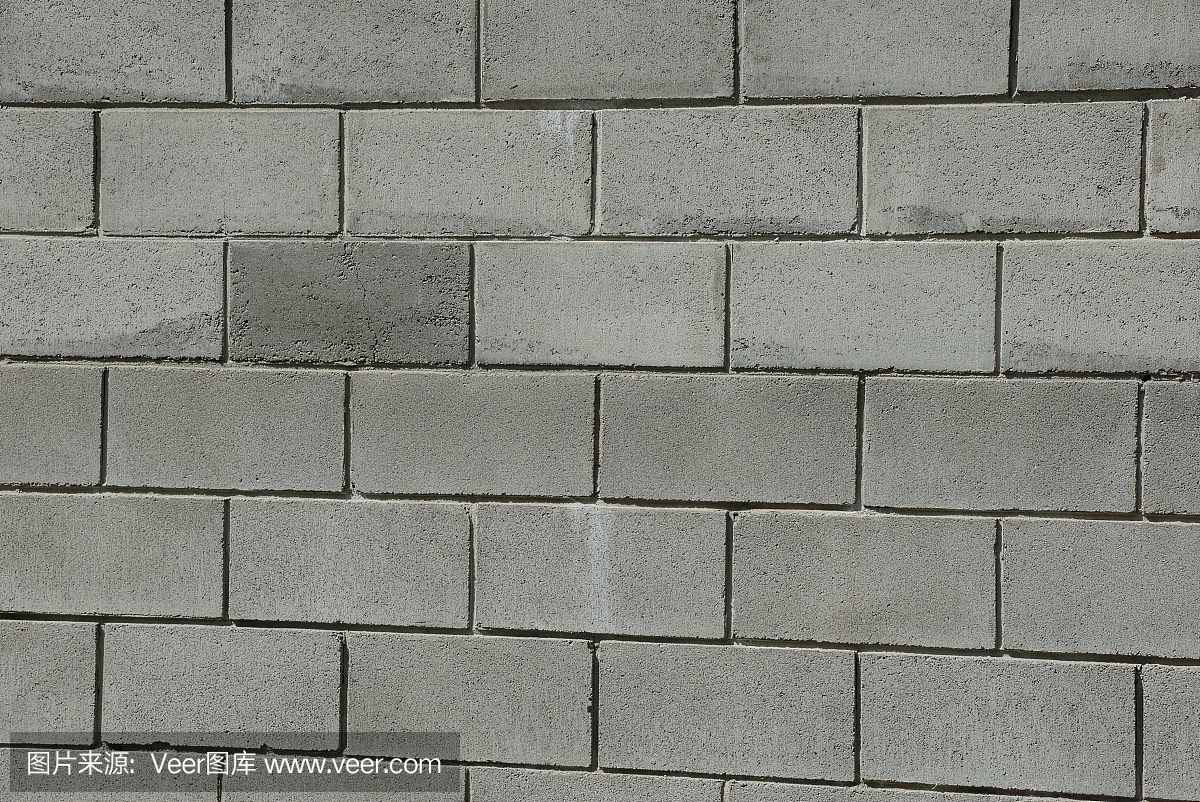 灰色石头纹理的砖在建筑的墙壁上